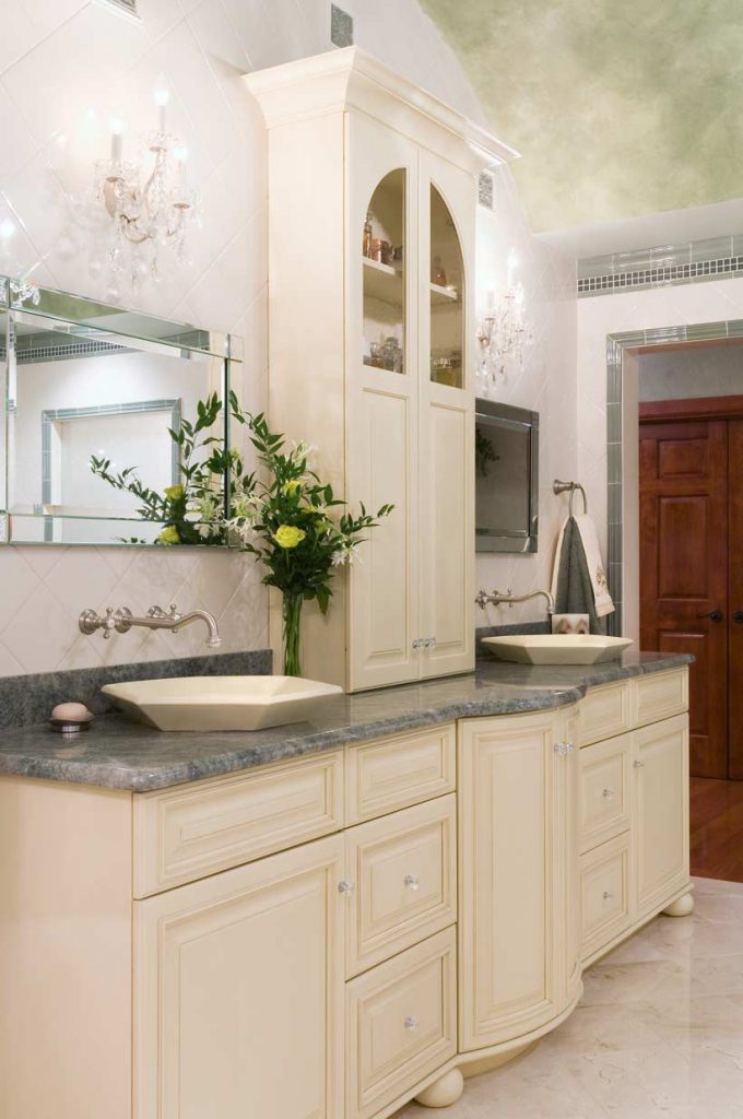 Maple bathroom cabinetry with two vessel sinks and a granite countertop Williams Township, PA