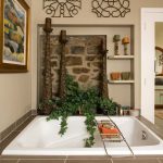 Drop-in bathtub in an oasis with stone and a plant Bethlehem, PA