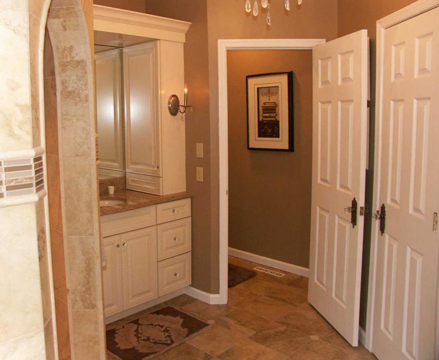 Bathroom with a vanity and a shower with an arched doorway Macungie, PA