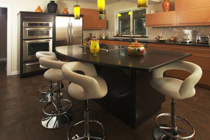 large contemporary kitchen with granite counter tops and stainless steel appliances designed by morris black designs