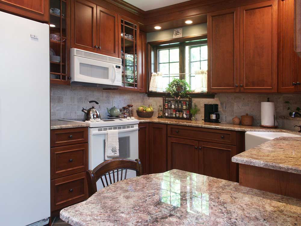 Kitchen with cherry cabinets and white appliances Bethlehem, PA