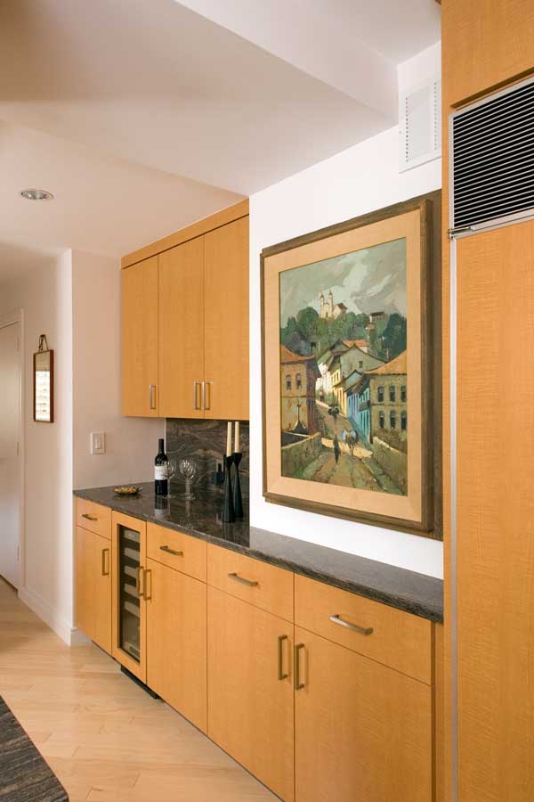 contemporary maple kitchen in Philadelphia pa includes an under counter wine fridge for homeowners