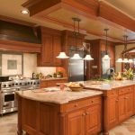multilevel island and stainless steel appliance signature custom cabinetry