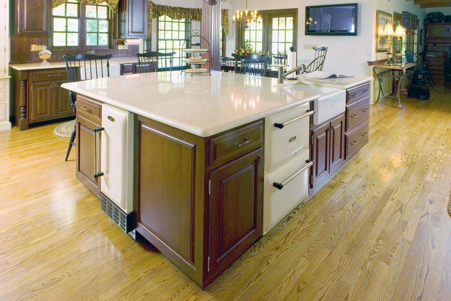 large traditional kitchen with oversized white kitchen island in macungie pennsylvania designed by morris black designs