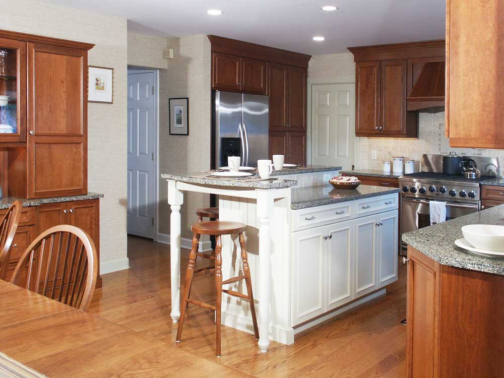 Traditional kitchen with white multilevel island and stainless steel appliances Center Valley, PA