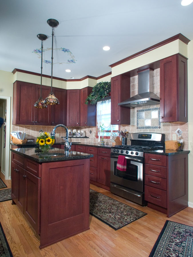 beautiful traditional L shaped kitchen in Bethlehem pa with stained cherry yorktowne cabinetry and granite countertops