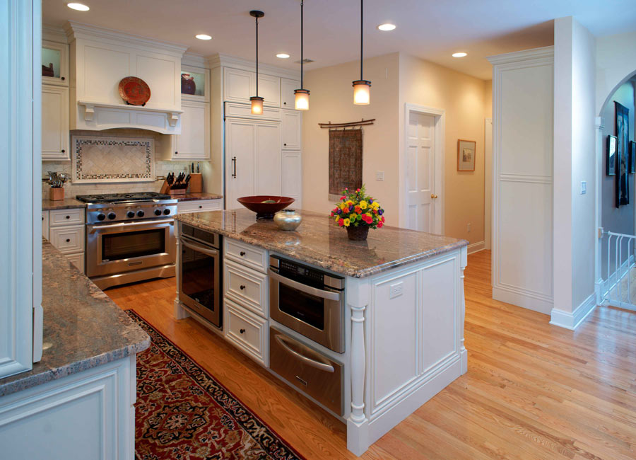 this traditional kitchen remodel by Morris Black was created to include crisp white cabinets and granite