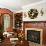 Parlor with bookshelves, low round table, chairs, and fireplace Allentown, PA