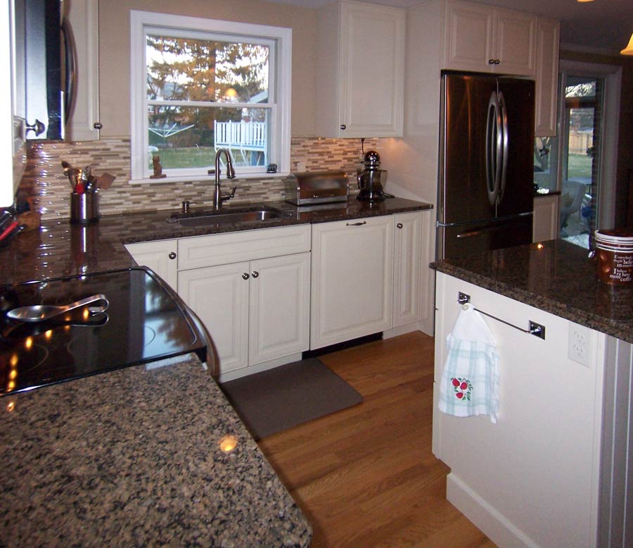 beautiful traditional white kitchen with white kraftmaid cabinets designed by Morris Black Designs in bethlehem pa