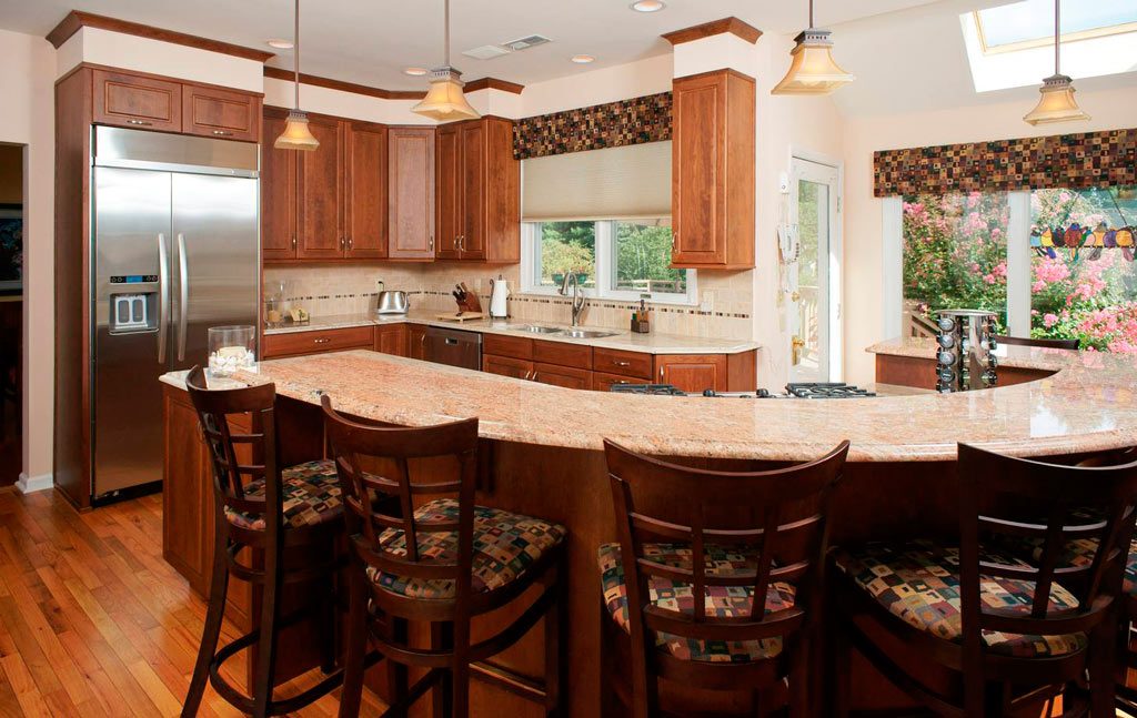 transitional cherry kitchen with granite curved countertop designed by morris black designs in Allentown pennsylvania