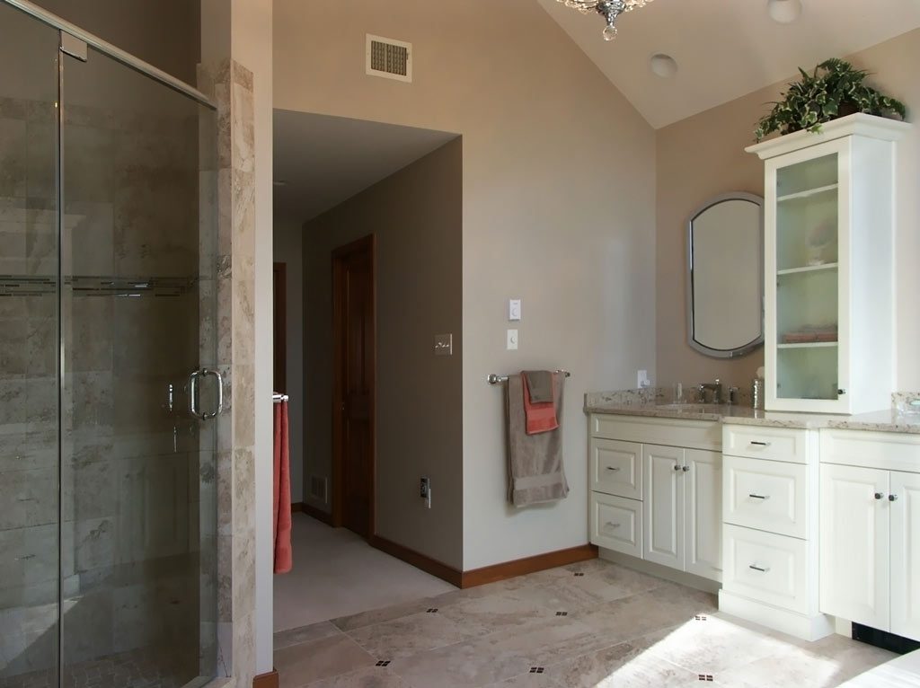 Bathroom with shower and white cabinetry Allentown, PA