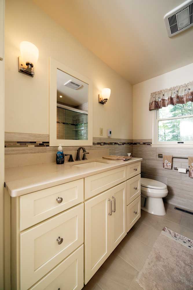 shaker style bathroom with a white vanity and mirror