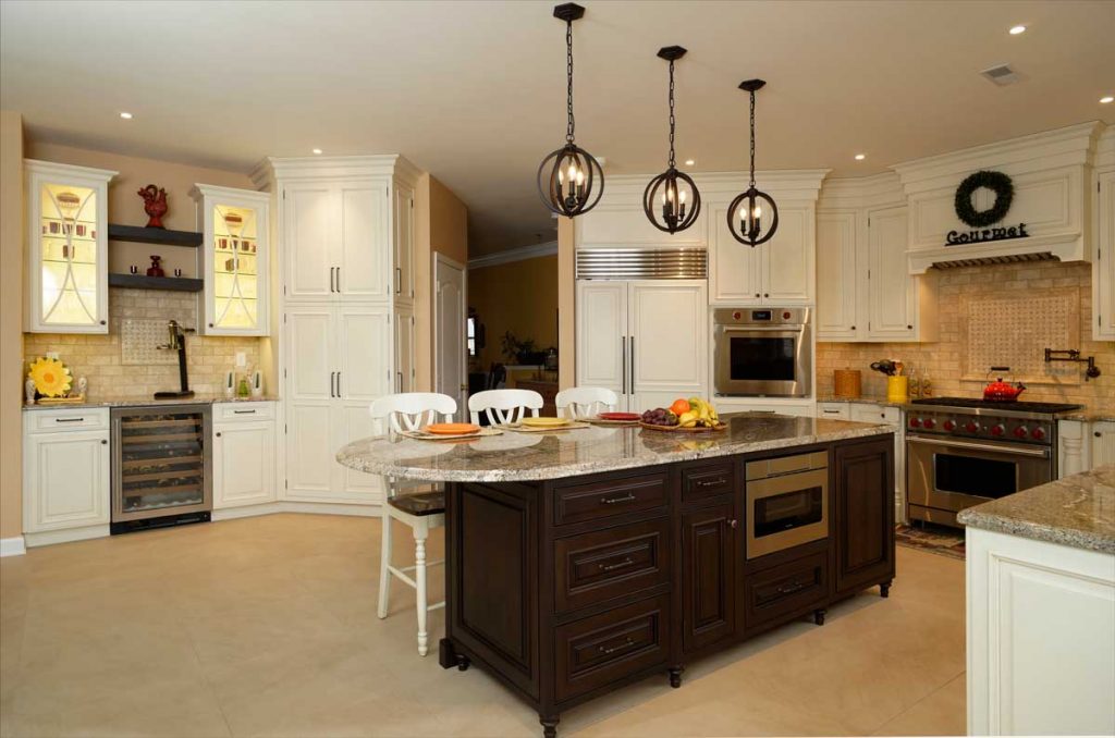 traditional white cabinetry in a traditional kitchen design with a wine fridge