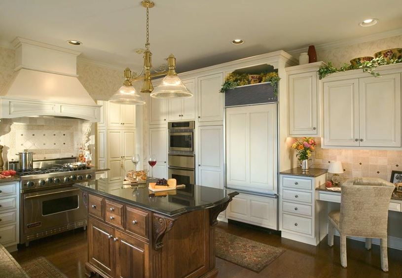 dark wood island with white perimeter cabinets to create two toned kitchen cabinets