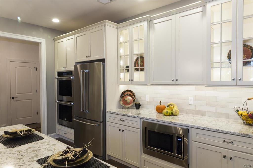 White Kitchen Cabinets with Glass Door Fronts in Coopersburg, PA
