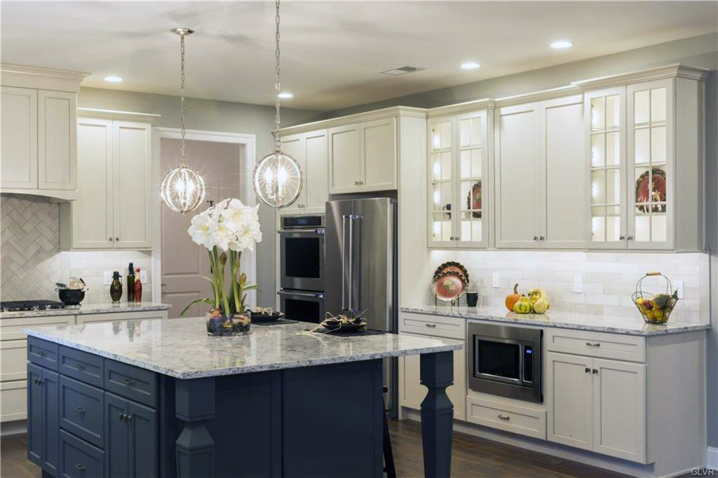 Contrasting kitchen islands is the best way to use the latest design trend.
